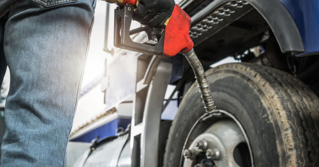 Driver holding diesel fuel nozzle showing performance improvements discussed in the ECM repair guide